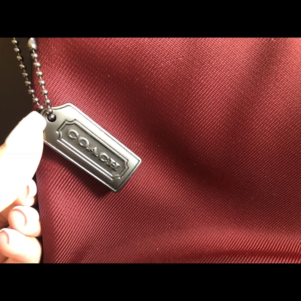 Coach clutch with strap